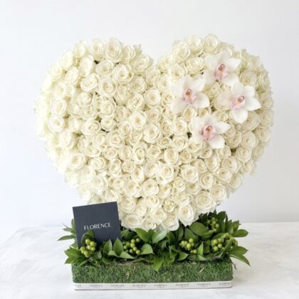 Atelier Amelie Standing Heart - Avant-Garde Floral Art featuring dense white roses and delicate orchids in a heart shape.