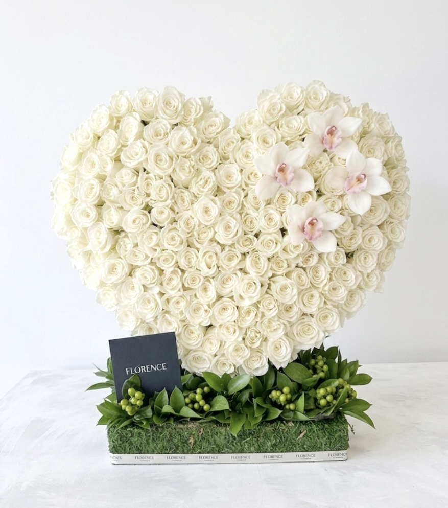 Atelier Amelie Standing Heart - Avant-Garde Floral Art featuring dense white roses and delicate orchids in a heart shape.