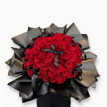 Sposa Serena - Wrapped Bouquet features luxurious red roses elegantly arranged with black satin ribbons.