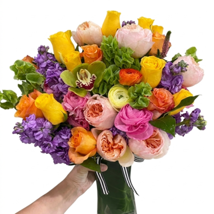A luxurious arrangement of vibrant roses and orchids in a Golden Honey - Vase, featuring pink, yellow, and purple hues.