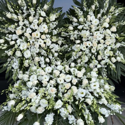 Silent Sympathy Funeral Set featuring elegant white roses, lilies, and stock flowers in a lush, dignified floral tribute.