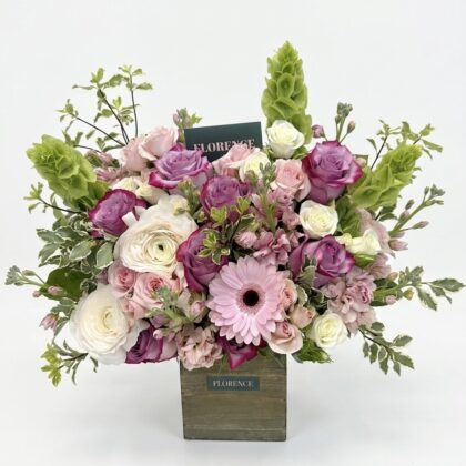 Fiore de Florence - Wood Pot featuring elegant pink and purple roses, white ranunculus, and lush greenery.