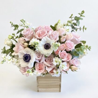 Ciao Ballerina - Wood Pot features soft pink roses, white anemones, and delicate greenery in an elegant arrangement.