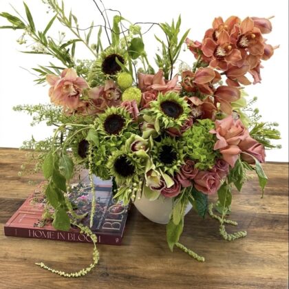 Luxurious Modern Muse - Concrete Vase filled with pink roses, green hydrangeas, and vibrant sunflowers.
