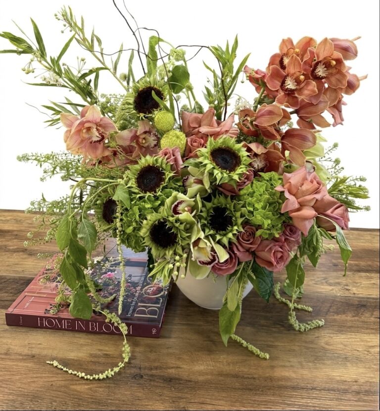 Luxurious Modern Muse - Concrete Vase filled with pink roses, green hydrangeas, and vibrant sunflowers.