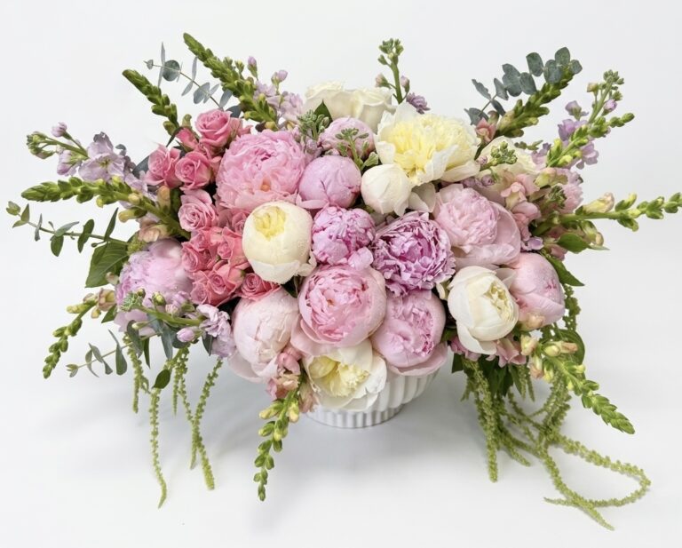 Luxurious Peonies Galore - Ceramic Vase featuring soft pink and white peonies, elegantly arranged with delicate greenery.