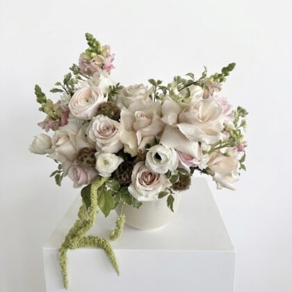 Elegant Golden Sand - Ceramic Vase filled with soft pink and white roses, accented by delicate greenery.