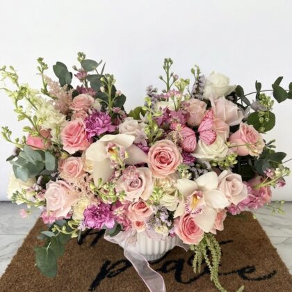 Luxurious Dolce Perla - Ceramic Vase filled with soft pink roses, orchids, and delicate greenery.