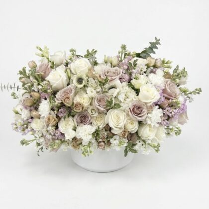 Elegant Monte Carlo - Ceramic Vase filled with soft pink and white roses, accented by delicate lavender blooms.