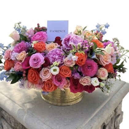 Bacio Di Zucchero - Ceramic Vase filled with vibrant roses in pink, orange, and lavender hues, elegantly arranged.