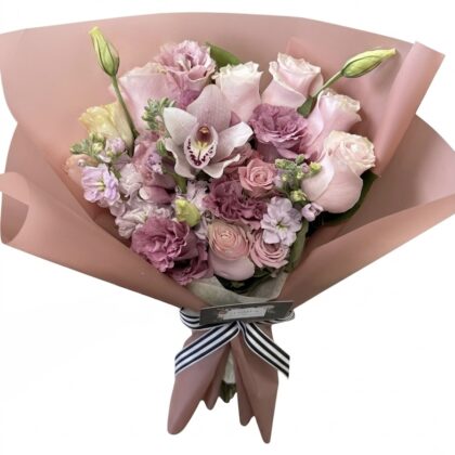 Luxurious bouquet featuring soft pink roses, elegant orchids, and delicate lisianthus, beautifully arranged.