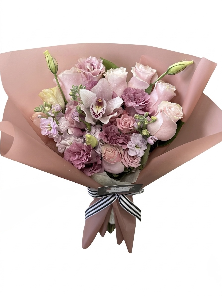 Luxurious bouquet featuring soft pink roses, elegant orchids, and delicate lisianthus, beautifully arranged.