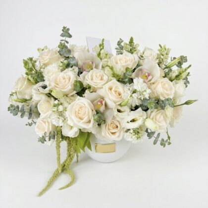 Villa Blanca – Timeless Ceramic Vase filled with cream roses, orchids, and eucalyptus in a lush, elegant arrangement.