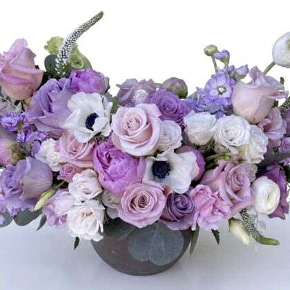 Jolie Plumage - Ceramic Vase adorned with elegant lavender and white roses, complemented by delicate greenery.