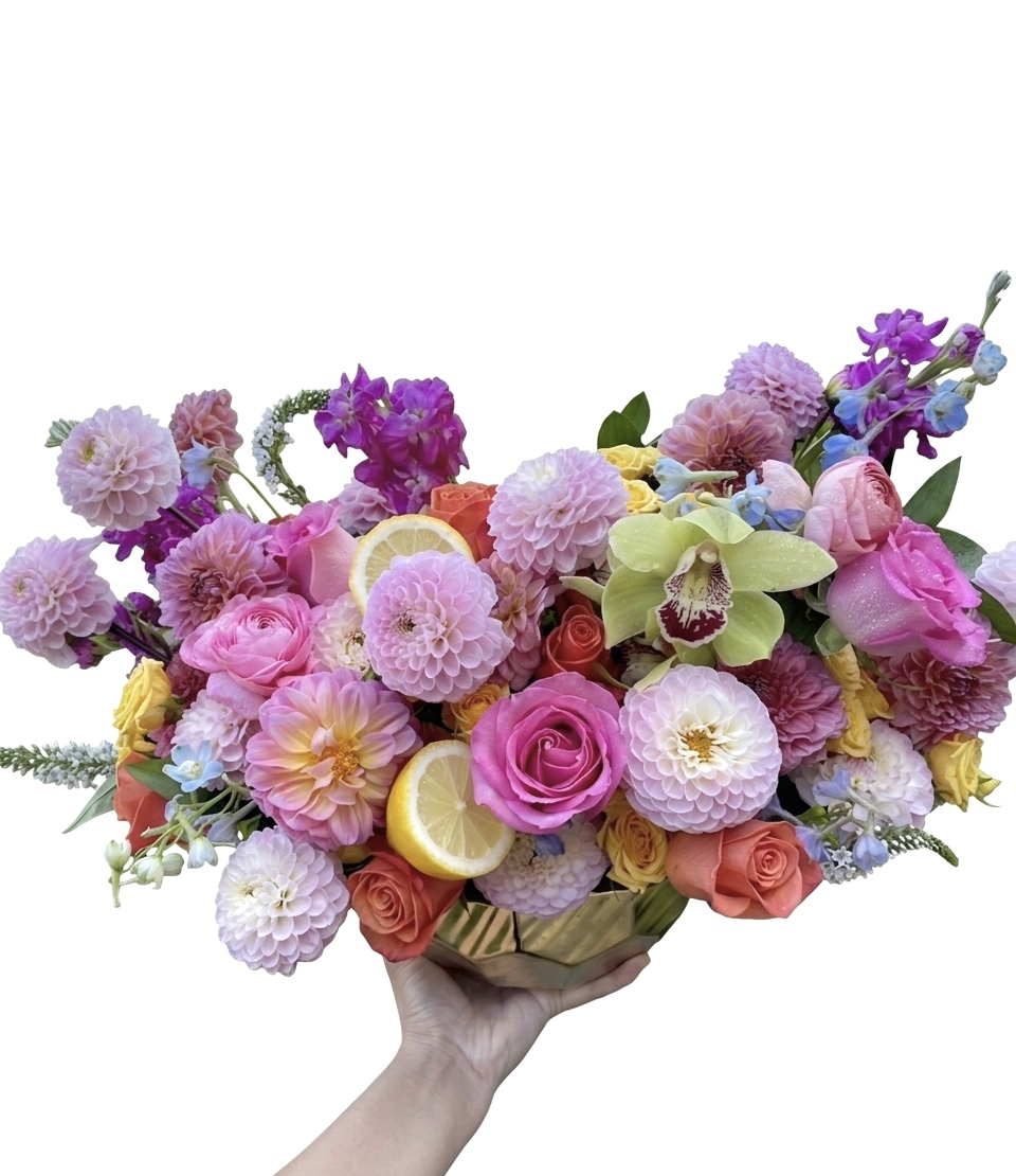 Coco Cherie – Vibrant Floral Masterpiece featuring dahlias, roses, and orchids in a gold ceramic vase.