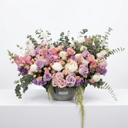 Mademoiselle Solange – Grand Concrete Vase featuring a lush arrangement of pastel roses, peonies, and eucalyptus.