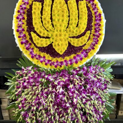 Precious Legacy – Lotus Double Layer Spray featuring a yellow lotus design on purple and yellow chrysanthemums.