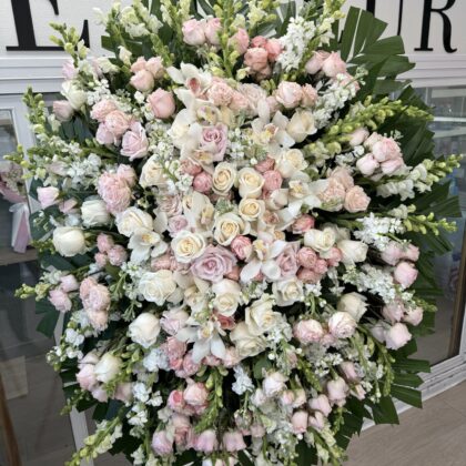 Eternal Grace Funeral Spray - Elegant Floral Tribute featuring soft pink and cream roses, orchids, and snapdragons.