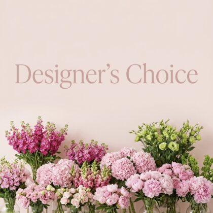 A beautiful arrangement of pink flowers including peonies, hydrangeas, and snapdragons in glass vases.