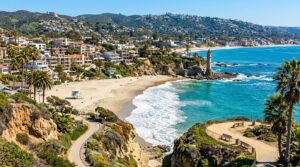 Scenic view of Victoria Beach in Laguna Beach, CA, featuring the iconic Pirate Tower and turquoise ocean waters.