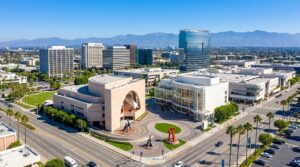 Aerial view of the Segerstrom Center for the Arts in Costa Mesa, CA, featuring modern architecture and urban landscapes.